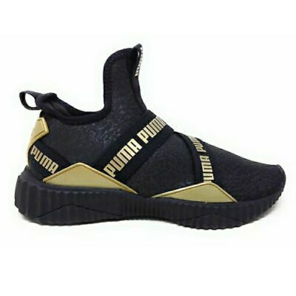puma defy mid black and gold